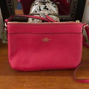 Bright pink Coach crossbody purse